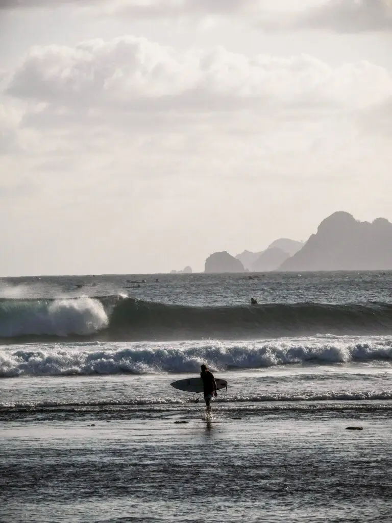 Surfer wrapping up his session at Mawi Beach in Lombok