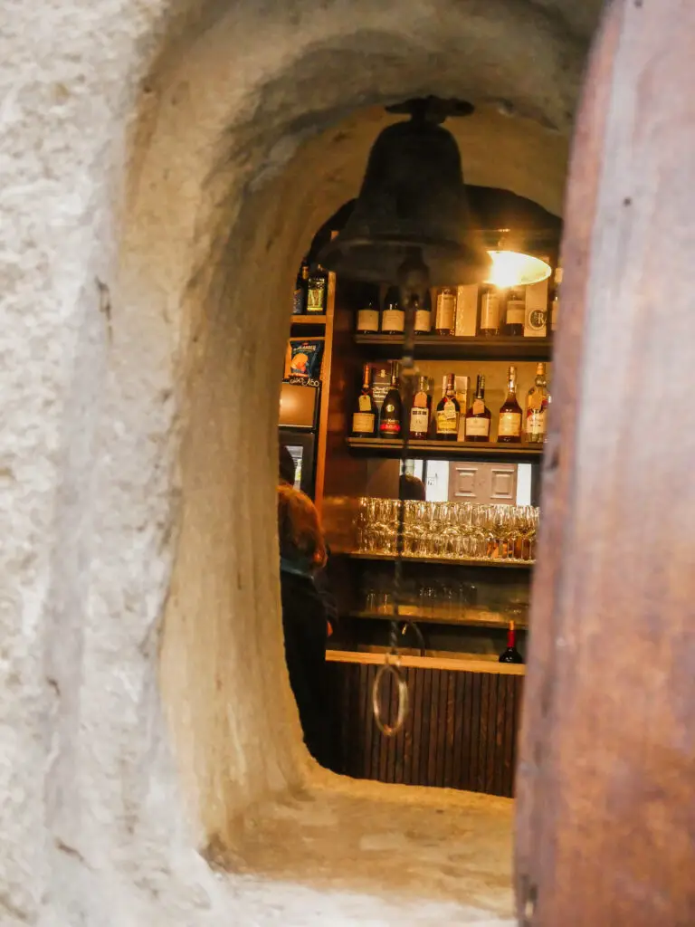 Peeking through a Florence wine window, ready to order a glass