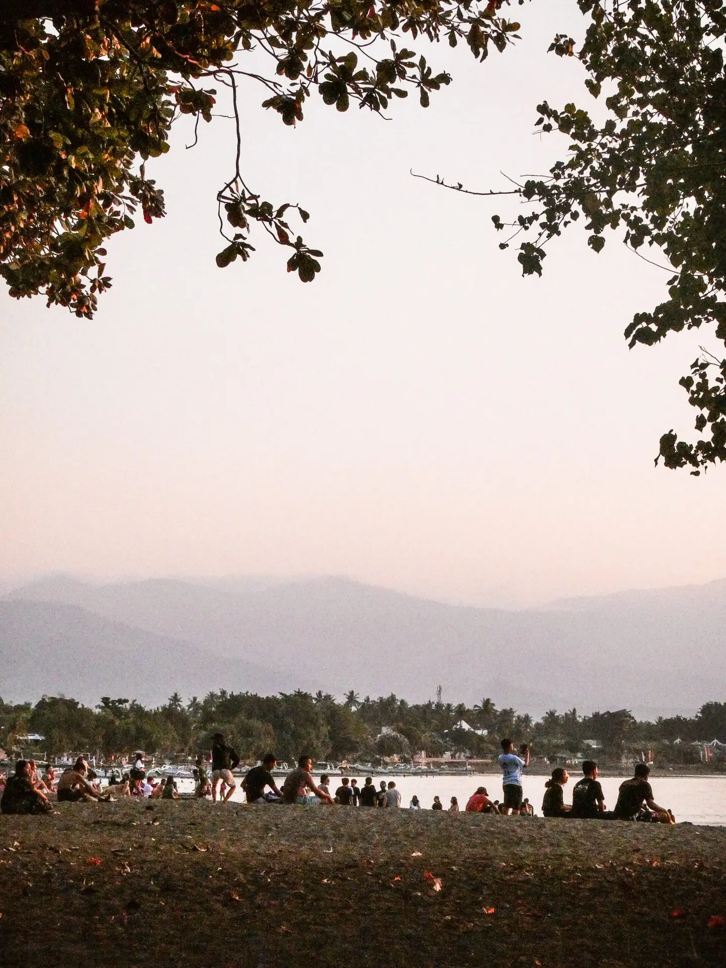 Sunset crowd on the beach in Lovina in Bali